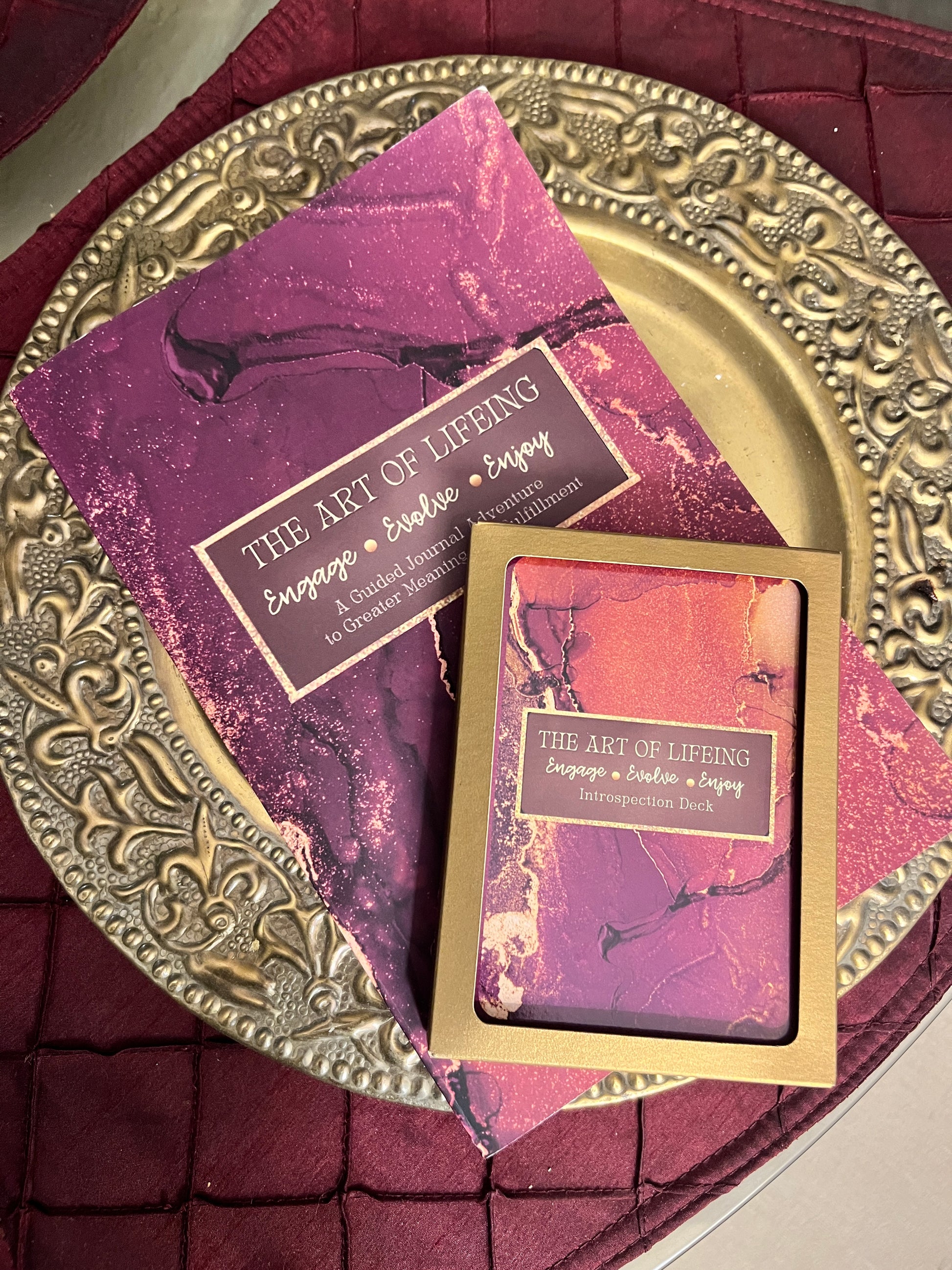 The Art of LIFEing Journal and card deck laying on a table